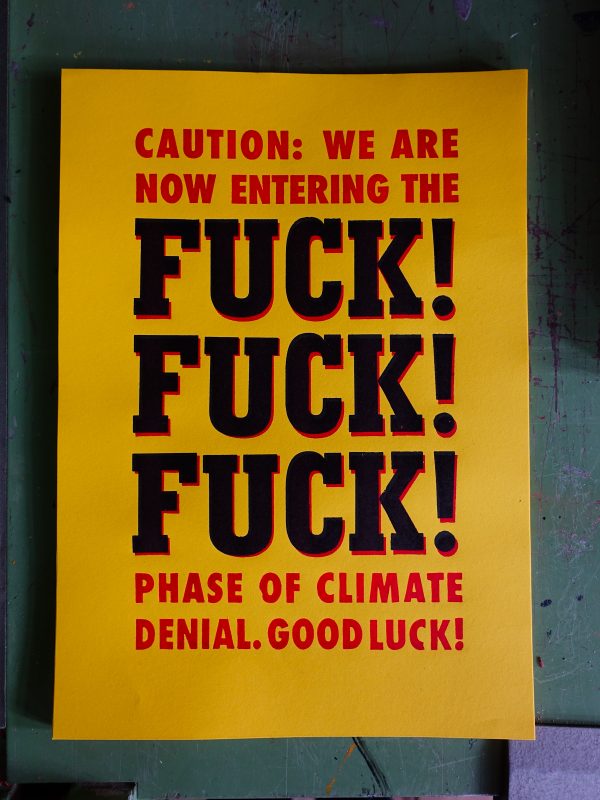 Plakat in rot und schwarz auf dem steht: Caution: We are Not entring the FUCK! FUCK! FUCK! Phase of climate denial. Good Luck!